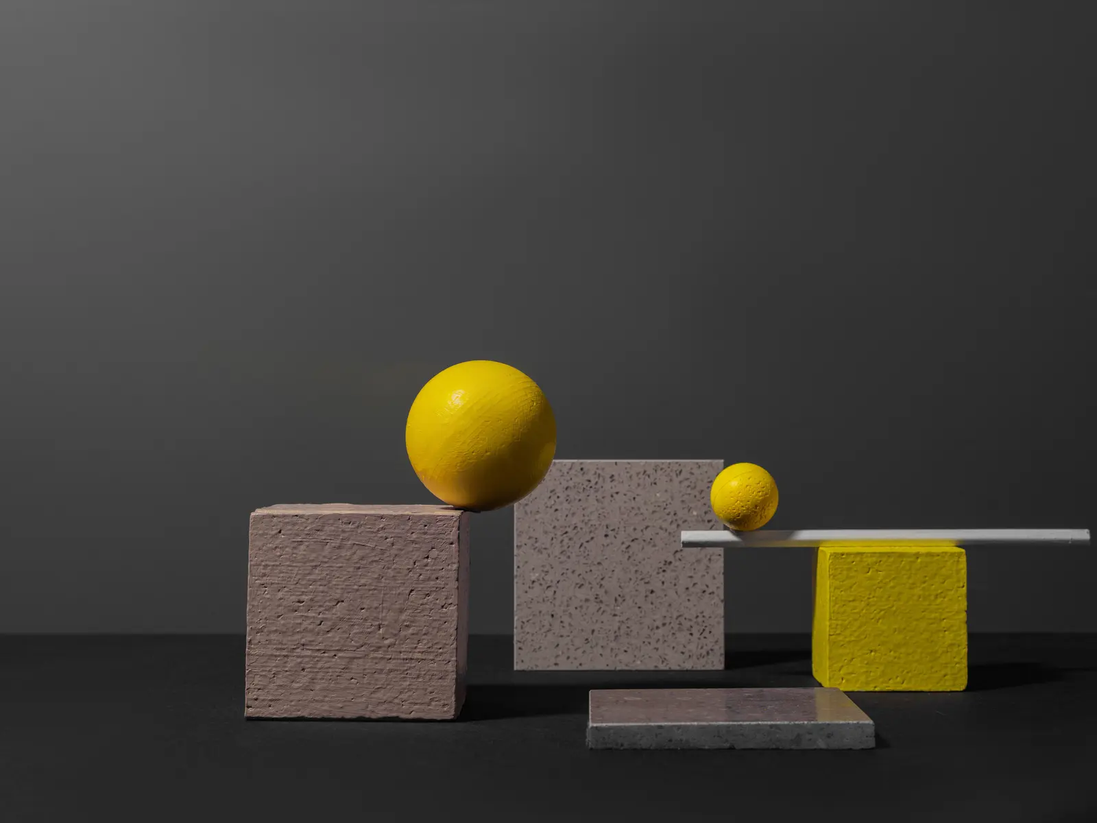 Composição geométrica em amarelo e grafite, as cores da Agência Maximum